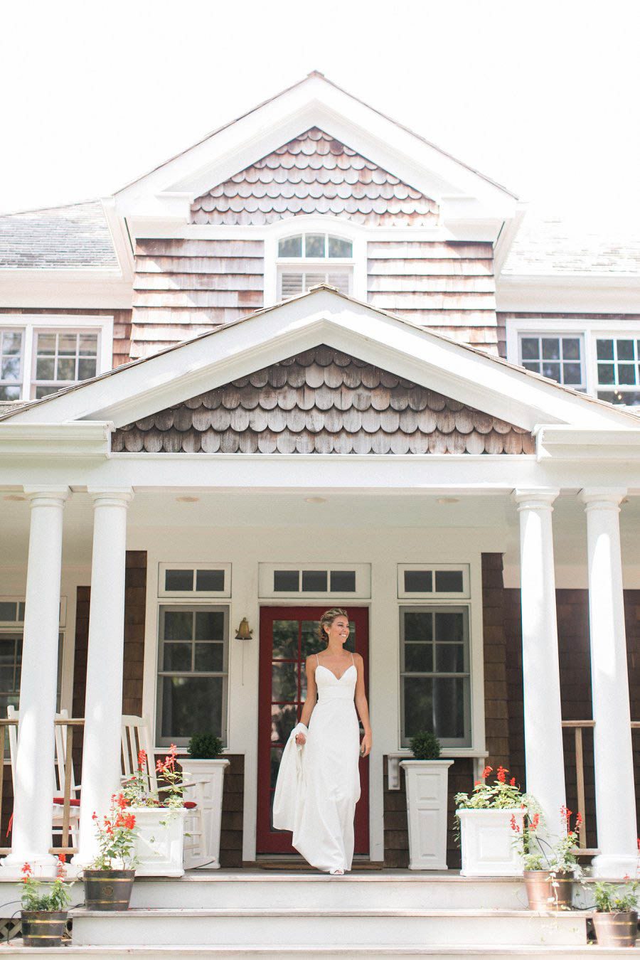 Bride outside at Bridgehampton Tennis and Surf Club wedding in photo by Long Island wedding photographer Amy Rizzuto.