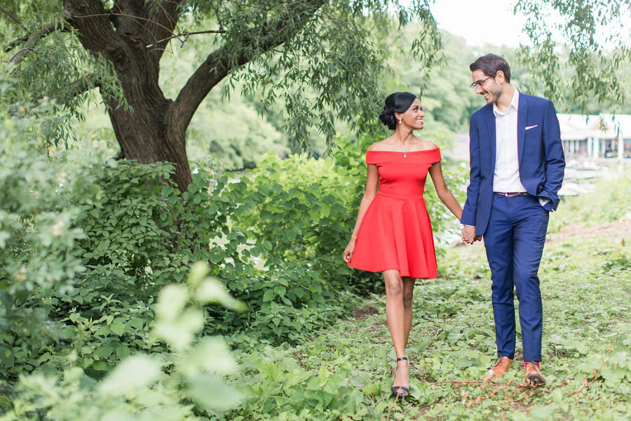 Couple poses hand in hand in this Central Park engagement photo by NYC wedding photographer Amy Rizzuto