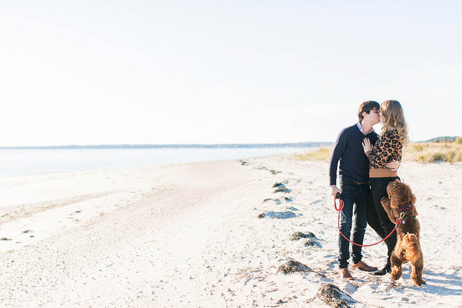 Beach engagement photo by Hamptons wedding photographer Amy Rizzuto Photography. Adorable engagement photo with dogs.