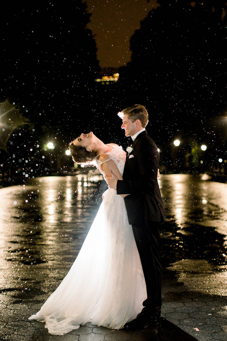 Central Park wedding photo at night in the rain captured by Amy Rizzuto Photography