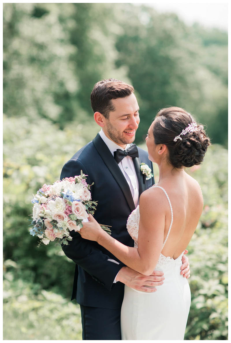 Emotional first look photo with personal vows at Le Chateau wedding captured by best NYC wedding photographer Amy Rizzuto Photography