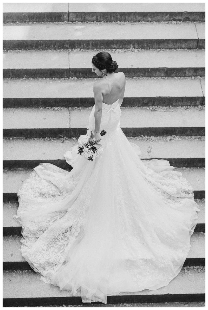 Bride on bethesda terrace steps in Central Park wedding photo captured by best Central Park wedding photographer Amy Rizzuto Photography