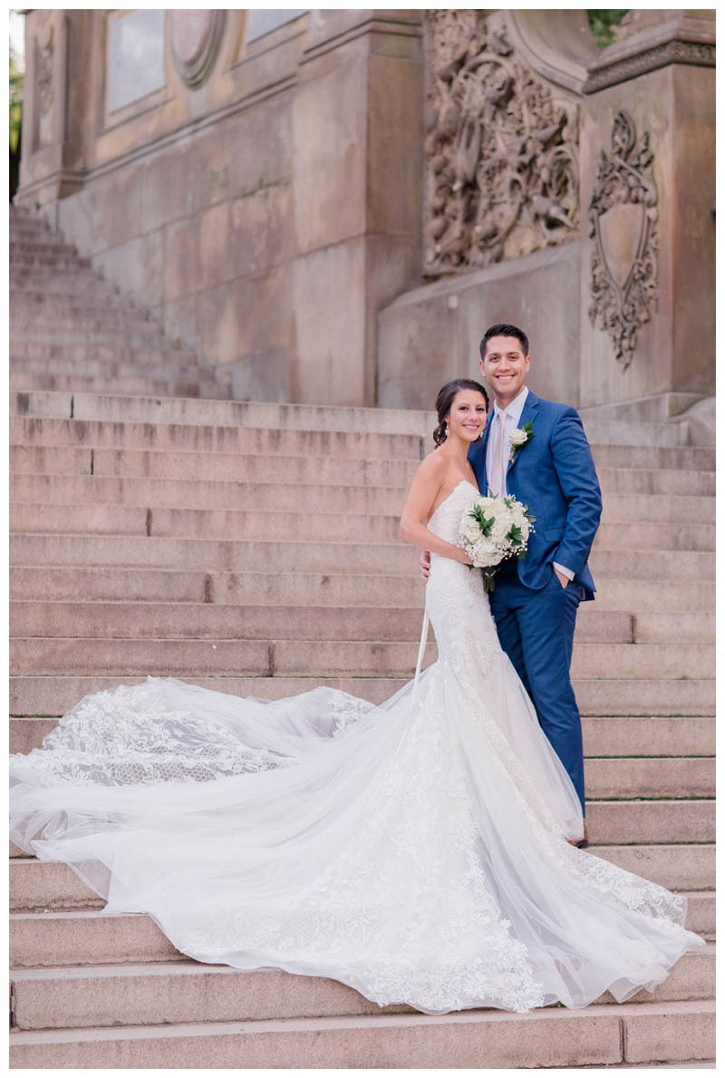 Bride and groom on bethesda terrace steps in Central Park wedding photo captured by best Central Park wedding photographer Amy Rizzuto Photography