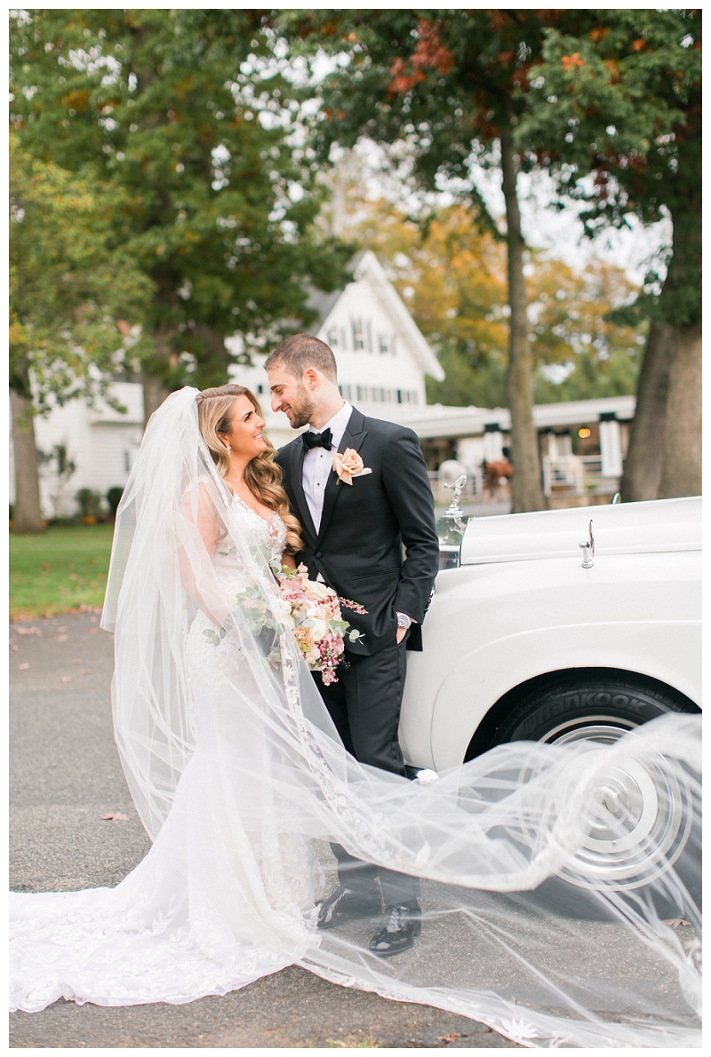 bride and groom with vintage car at ryland inn wedding