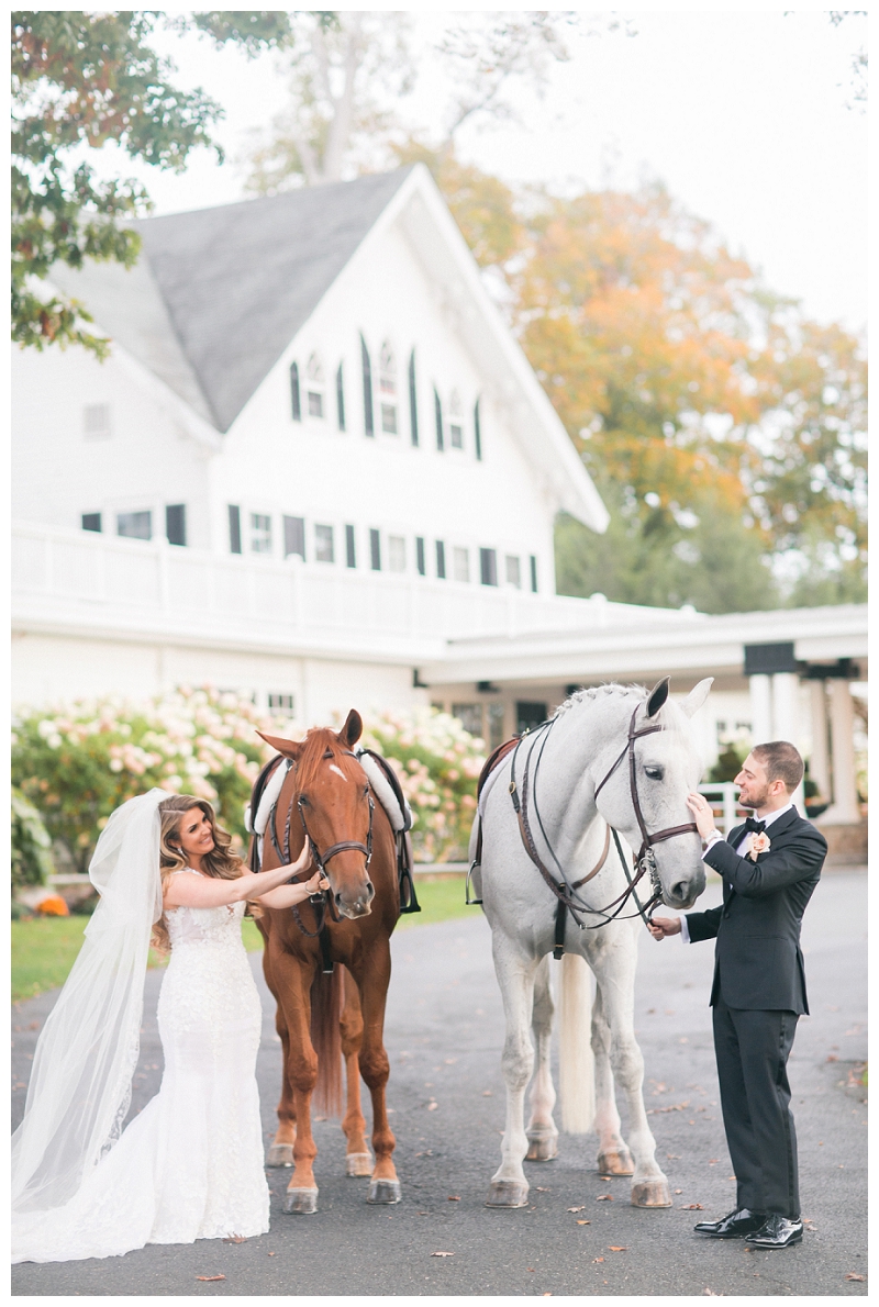 bride and groom with horses at ryland inn wedding