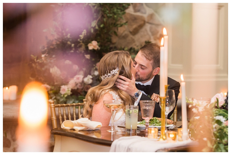 bride and groom kiss at ryland inn wedding