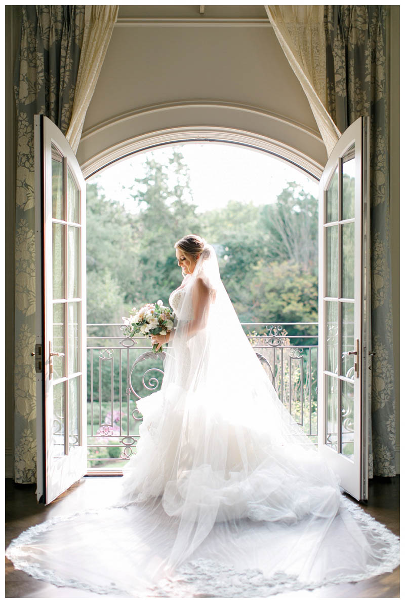 Beautiful bride photo on balcony at Park Chateau wedding captured by Amy Rizzuto Photography