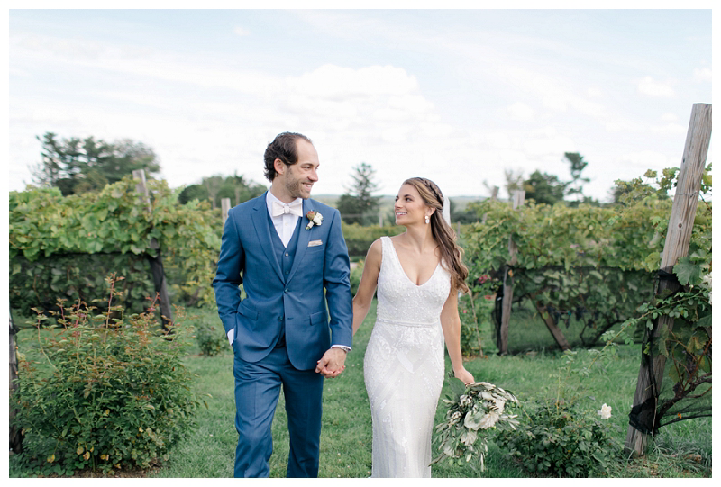 bride and groom in vineyards at winery wedding