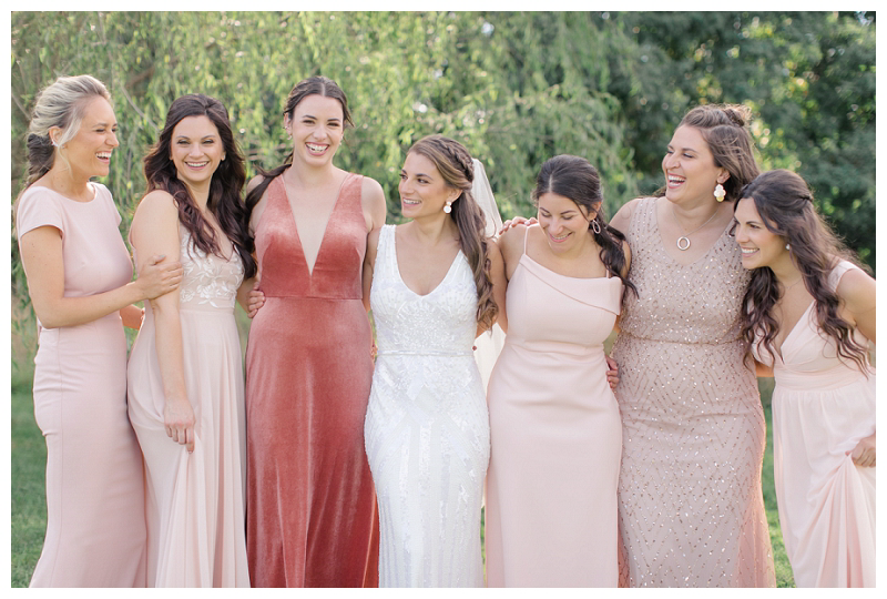 Bride with bridesmaids in pink and blush BHLDN bridesmaid dresses