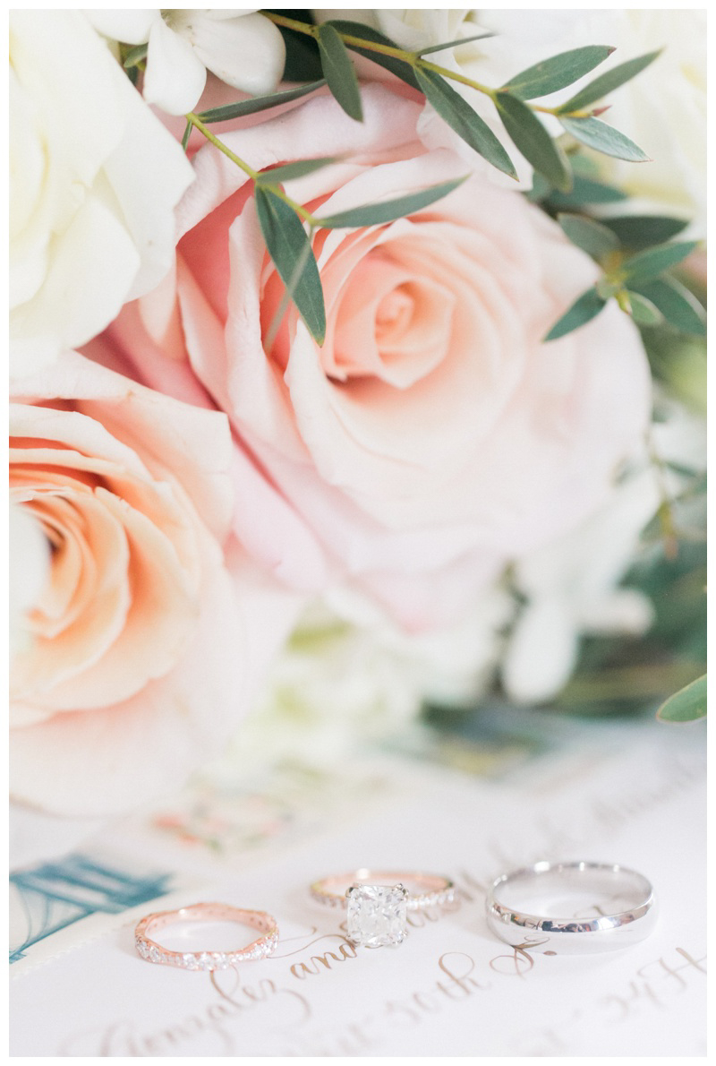 wedding ring detail photo featuring rose gold diamond engagement ring, rose gold diamond wedding ring, silver men's wedding ring