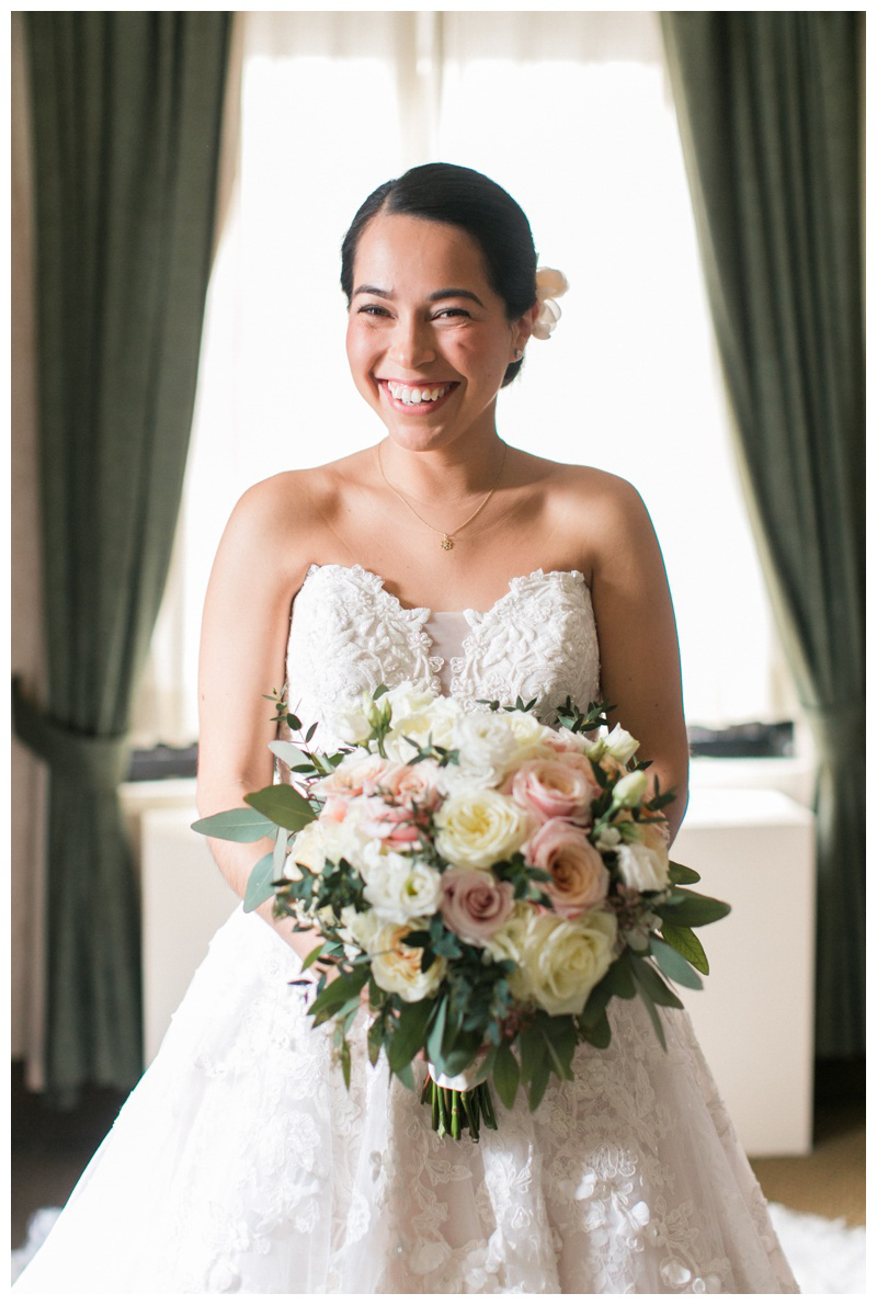 happy bride getting ready photo with pink and white bouquet