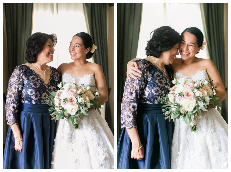 bride with mom on wedding day getting ready for nyc winter wedding, dark blue mother of the bride dress