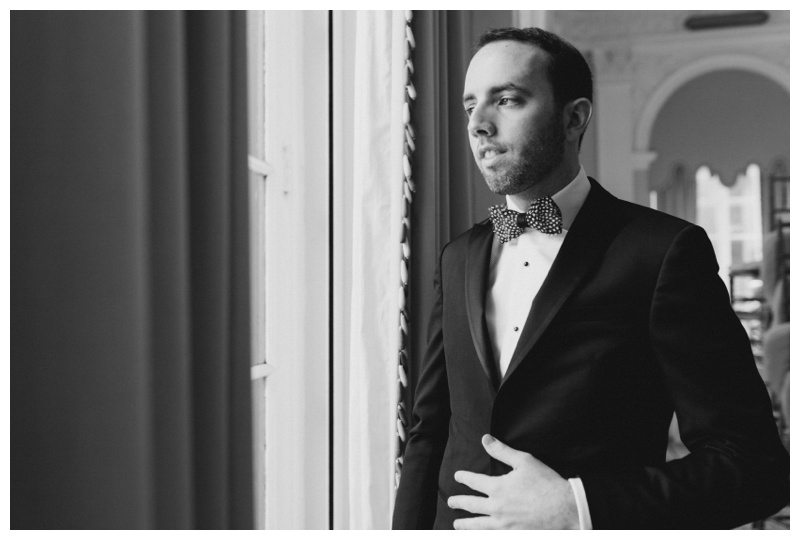 black and white groom getting ready photo