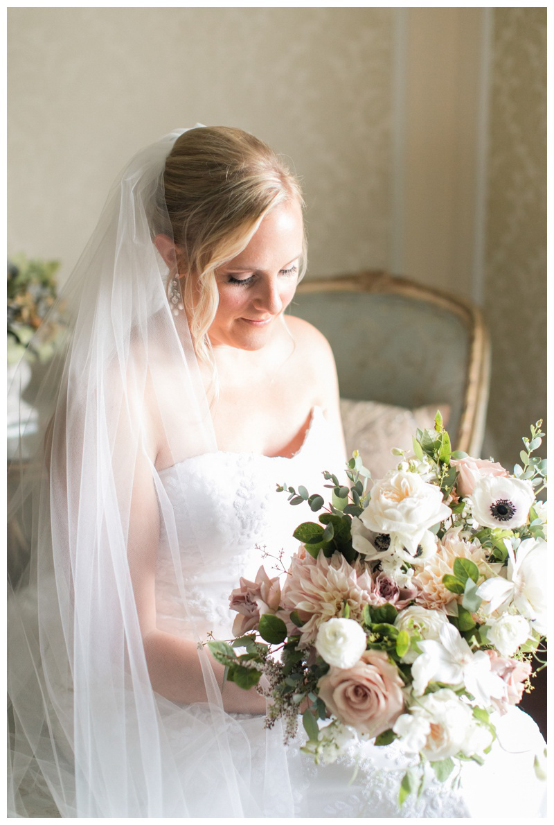 Bride with blush cream white and greenery bouquet
