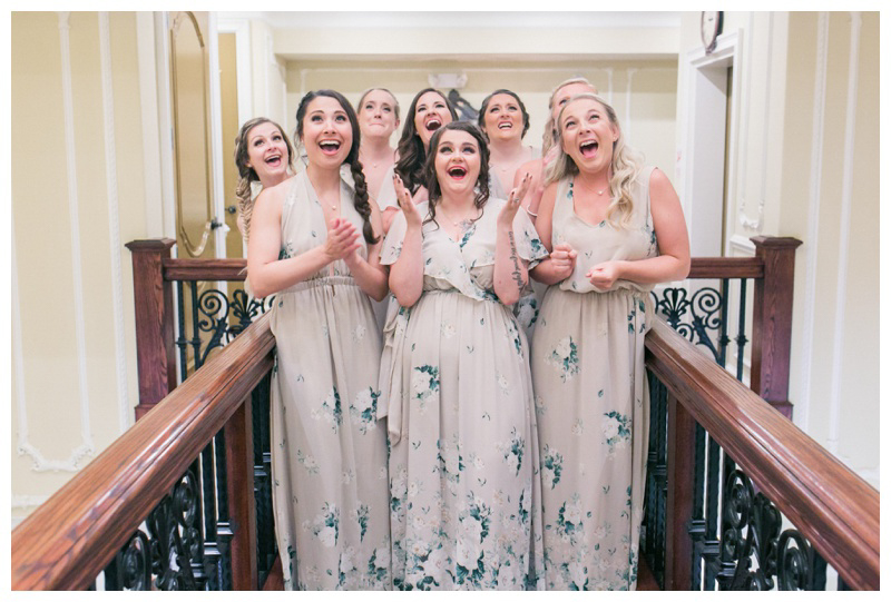Bridesmaids see bride in her wedding dress, excited bridesmaids