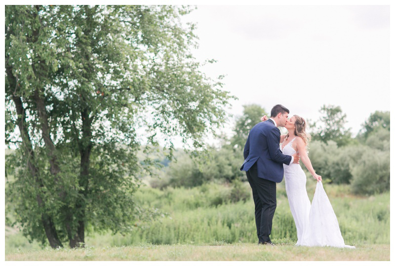 Couple kisses at best outdoor wedding venue in NJ Bear Brook Valley captured by NJ wedding photographer Amy Rizzuto Photography